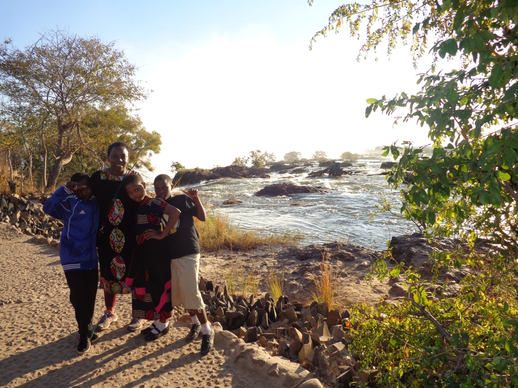 Bettie and the kids near the Zambezi River rapids